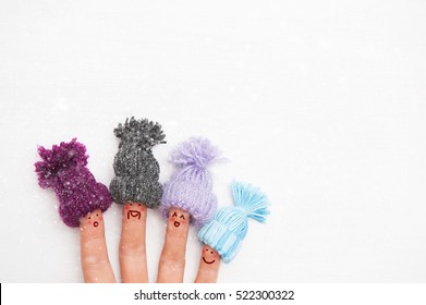 Happy Family Fingers In Warm Knitted Hats With Bubonic Rejoices First Winter Snow.