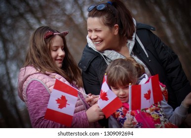 Happy Family With Flag Of Canada