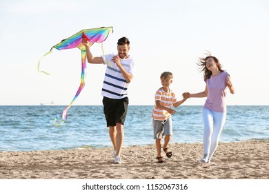 Happy Family Flying Kite Near Sea