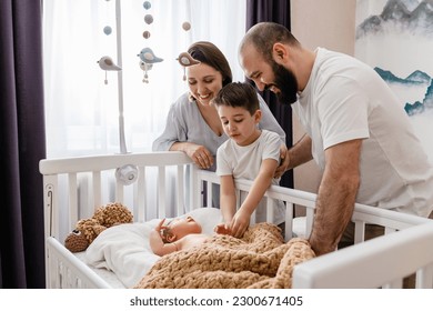 Happy family of four with newborn baby - Powered by Shutterstock