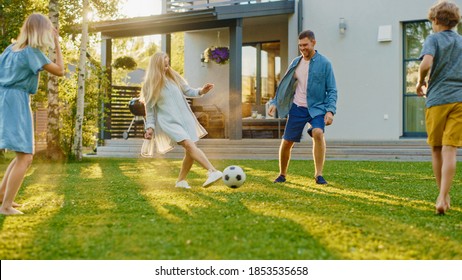 Happy Family of Four Playing Soccer, Passing Football to Each Other. Mother, Father, Daughter and Son Have Fun Playing Games in the Backyard Lawn of Idyllic Suburban House on Sunny Summer Day - Powered by Shutterstock