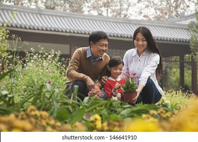 Happy Family In Garden