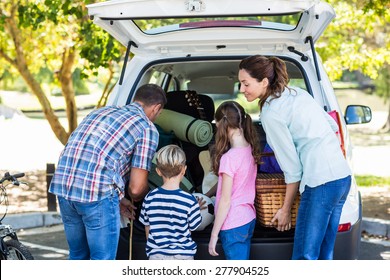 Happy Family Getting Ready For Road Trip On A Sunny Day