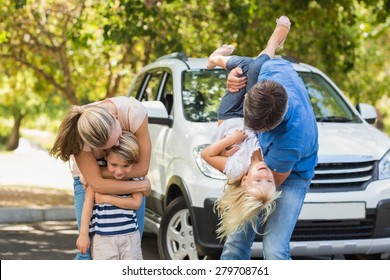 Happy Family Getting Ready For Road Trip On A Sunny Day