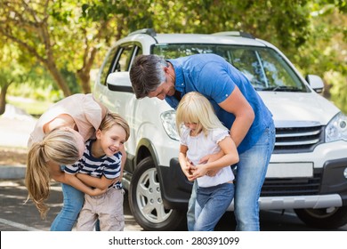 Happy Family Getting Ready For Road Trip On A Sunny Day