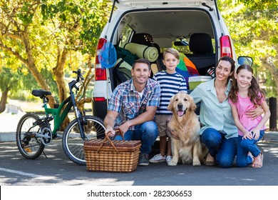 Happy Family Getting Ready For Road Trip On A Sunny Day