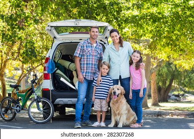 Happy Family Getting Ready For Road Trip On A Sunny Day