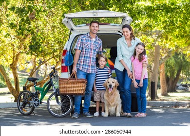 Happy Family Getting Ready For Road Trip On A Sunny Day