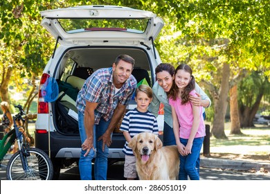 Happy Family Getting Ready For Road Trip On A Sunny Day