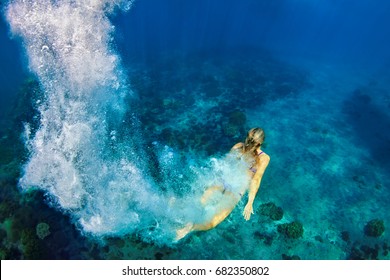 Happy family - girl in snorkeling mask dive underwater with tropical fishes in coral reef sea pool. Travel lifestyle, water sport outdoor adventure, swimming lessons on summer beach holiday with kids - Powered by Shutterstock