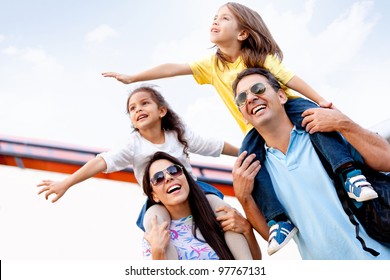 Happy Family Going On Holidays And Traveling By Airplane