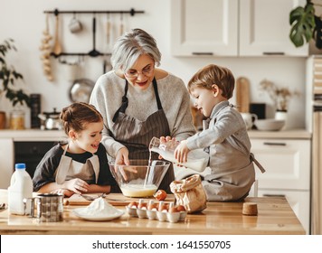 happy family grandmother and grandchildren cook in the kitchen, knead dough and bake cookies
 - Powered by Shutterstock