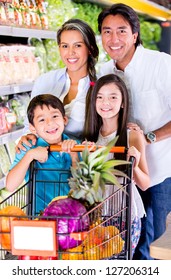 Happy Family At The Grocery Store Looking Very Happy