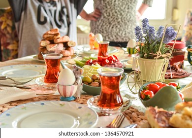 Happy Family Have Breakfast Together. Delicious Rich Traditional Turkish Breakfast Include Tomatoes, Cheese, Eggs, Bagels, Olives And Tea Cups. Ramadan Suhoor Aka Sahur (morning Meal Before Fasting). 