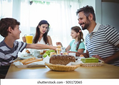 Happy Family Having Breakfast At Home