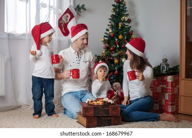 Happy Family Having Breakfast On Christmas