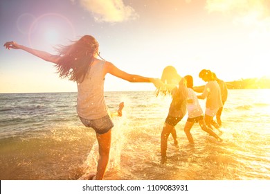 Happy Family Having Fun On The Beach