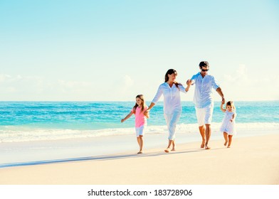 Happy Family Having Fun on Beautiful Sunny Beach - Powered by Shutterstock