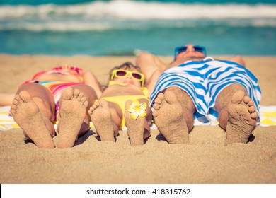 Happy Family Having Fun On The Beach. Summer Vacation And Travel Concept