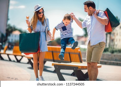 Happy family having fun outdoor after shopping