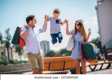 Happy family having fun outdoor after shopping