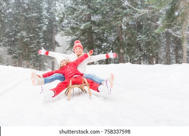 Happy Family Having Fun Outdoor. Mother And Child Playing In Winter Time. Active Healthy Lifestyle Concept