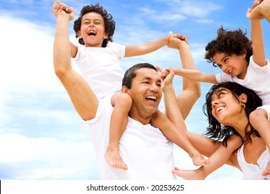 Happy Family Having Fun Outdoors While On Vacation