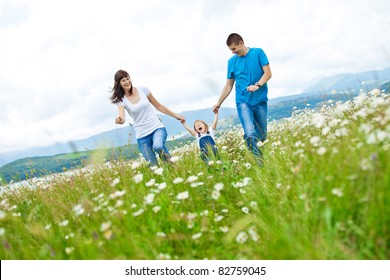 Happy Family Having Fun Outdoors