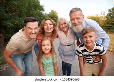 Happy family having fun in park