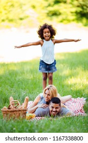 Happy Family Having Fun Time On Picnic