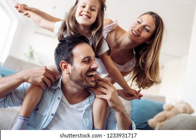 Happy family having fun time at home - Shutterstock ID 1233931717