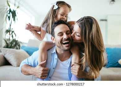 Happy family having fun time at home - Shutterstock ID 1278000217