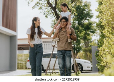 Happy Family Having Fun Time At Home. Asian Family With Little Kids Daughter Playing Together In House Backyard Outside. Happy Family Time.