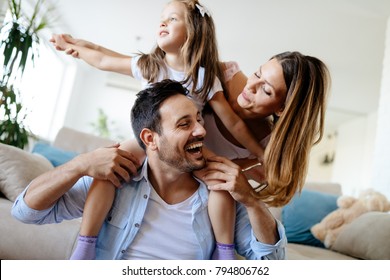 Happy family having fun times at home - Shutterstock ID 794806762