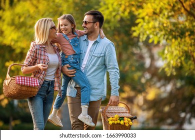 Happy Family Having Picnic In Nature.Smiling Family Picnicking In The Park.Summertime.