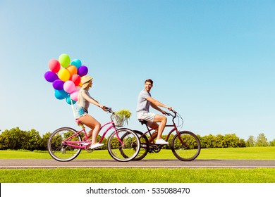 Happy Family Having Summer Weekend And Riding Bicycles.