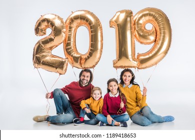 Happy Family Holding Sign 2019 Made Of Golden Balloons For New Year Isolated On White Background