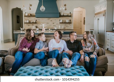 Happy Family At Home On Couch