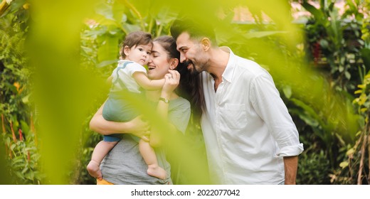 Happy Family At Home Together Concept, Children Joying With Father And Mother On Summer Nature Garden Outdoors, People Having Fun, Boy Or Girl And Young Woman Are Smiling Lifestyle Outside The Park