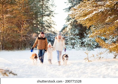 Happy Family And Husky Dog In Winter Park