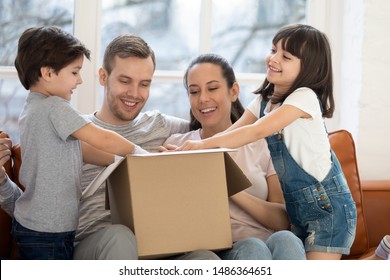 Happy Family With Kids Customers Renters Open Cardboard Box Receive Parcel Unpack After Relocation, Cute Children Helping Parents Unbox Package At Home, Post Shipping Delivery And Moving Day Concept