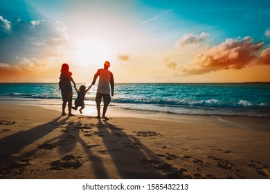 happy family with kids on play on sunset beach