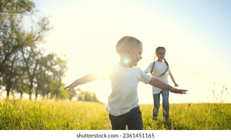 happy family kids. people in park children child running together in the park at sunset silhouette. mom dad daughter and son are run happy family and little child in fun summer. dream kids run - Powered by Shutterstock
