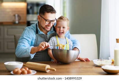 happy family in kitchen. Father and child son baking cookies together
 - Powered by Shutterstock