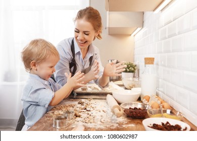 happy family in kitchen. mother and child son baking cookies together
 - Powered by Shutterstock