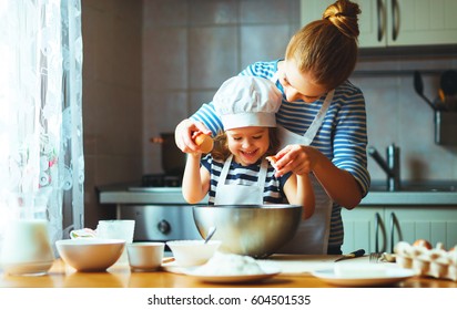 happy family in the kitchen. mother and  child daughter preparing the dough, bake cookies
 - Powered by Shutterstock