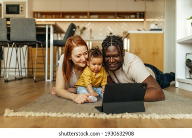 Happy Family, Laying On The Floor, Looking Cartoons Over The Tablet.