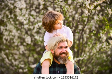 Happy Family. Little Boy And Father In Nature Background. Springtime. Hipster Piggybacking Baby. Bearded Brutal Man Good Father. Dad And Son. Best Dad Ever. Fathers Day. Child Having Fun With Dad.