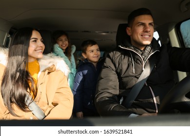 Happy Family With Little Children Inside Modern Car