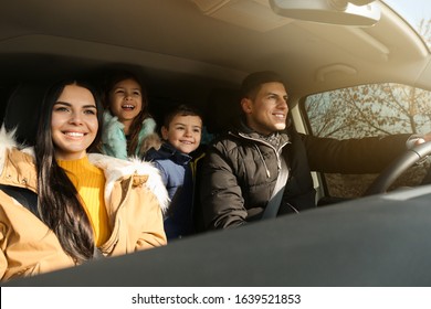 Happy Family With Little Children Inside Modern Car